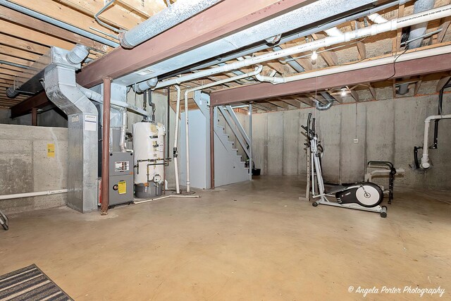 1381 Regency Ln, Lake Villa, IL 60046 - unfinished basement with gas water heater, stairs, and heating unit