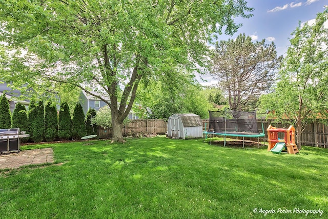 1381 Regency Ln, Lake Villa, IL 60046 - view of yard with a trampoline and a patio area