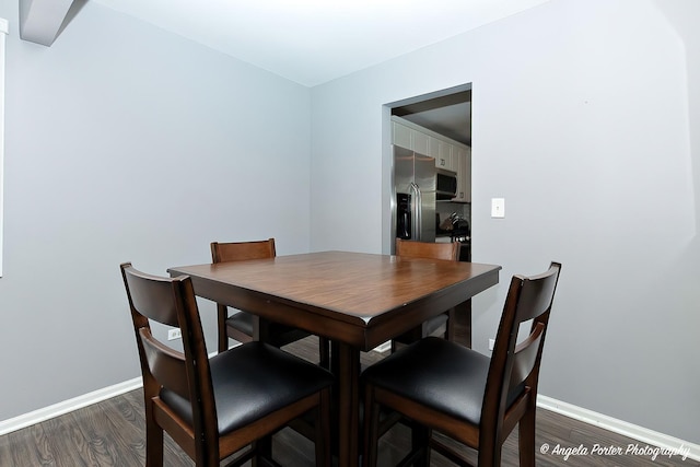 1381 Regency Ln, Lake Villa, IL 60046 - dining area with dark wood-style flooring and baseboards