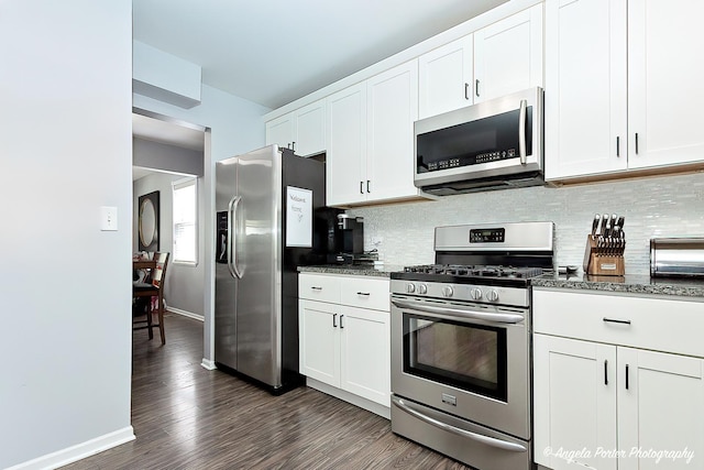 1381 Regency Ln, Lake Villa, IL 60046 - kitchen featuring stainless steel appliances, tasteful backsplash, dark wood-style floors, baseboards, and white cabinets