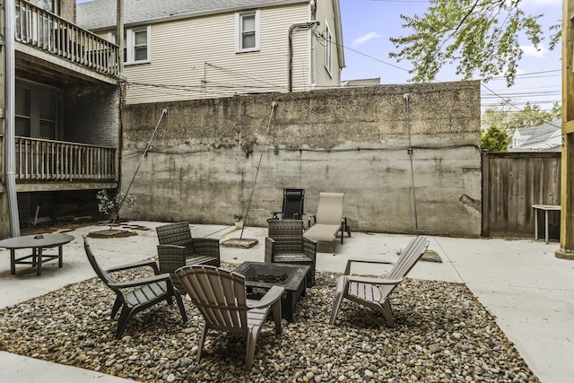 1946 W Newport Ave Unit 1E, Chicago, IL 60657 - view of patio with a fire pit and a balcony