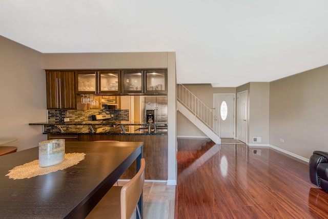 8 Cour Masson Cir Unit 0, Palos Hills, IL 60465 - unfurnished dining area featuring stairway, wood finished floors, and baseboards