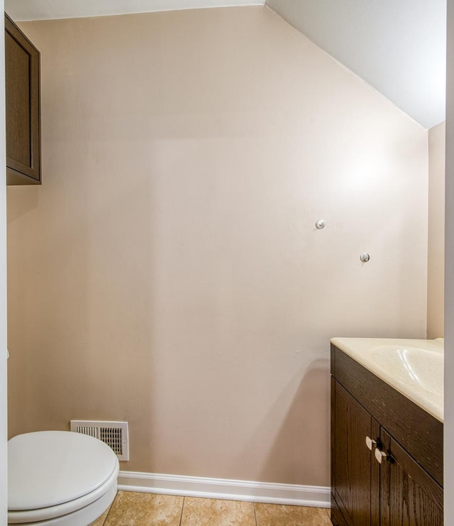 8 Cour Masson Cir Unit 0, Palos Hills, IL 60465 - bathroom with baseboards, vanity, lofted ceiling, toilet, and tile patterned floors