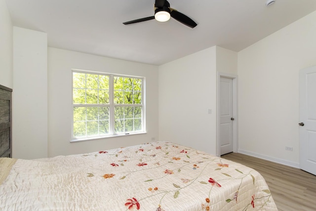 34382 N Aster Ct, Round Lake Beach, IL 60073 - bedroom with multiple windows, wood finished floors, baseboards, and a ceiling fan