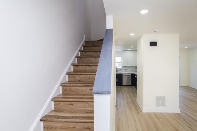 34382 N Aster Ct, Round Lake Beach, IL 60073 - stairway with wood finished floors, baseboards, and recessed lighting