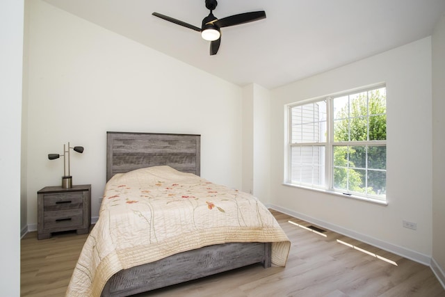 34382 N Aster Ct, Round Lake Beach, IL 60073 - bedroom featuring multiple windows, wood finished floors, baseboards, and lofted ceiling