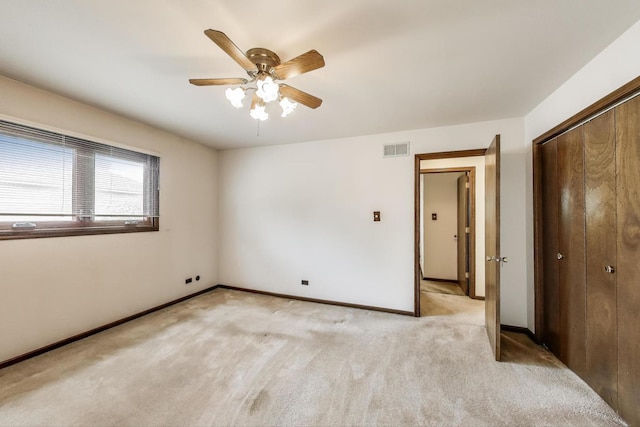 8923 Pebble Beach Ln, Orland Park, IL 60462 - unfurnished bedroom featuring light colored carpet, a closet, baseboards, and ceiling fan