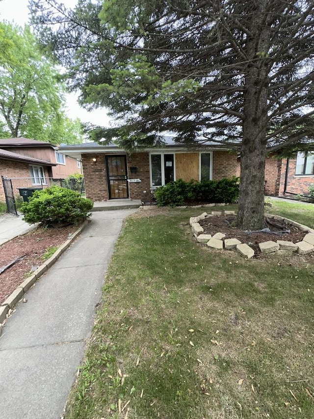 505 E 146th St, Dolton, IL 60419 - view of front of house with brick siding and a front yard