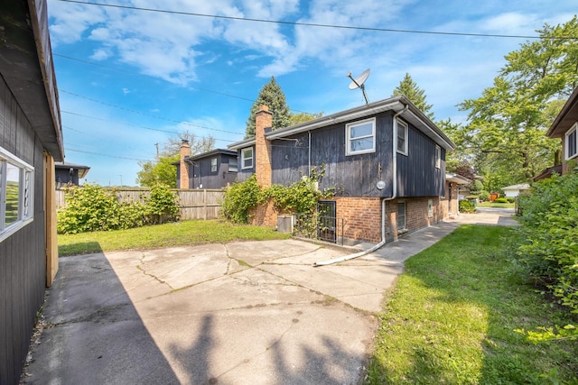 505 E 146th St, Dolton, IL 60419 - rear view of property featuring brick siding and a patio area