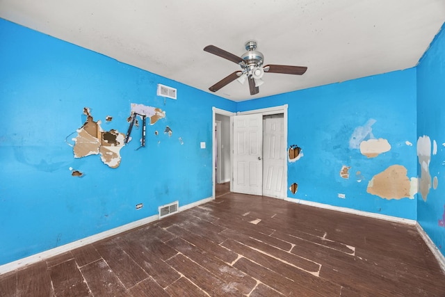 505 E 146th St, Dolton, IL 60419 - unfurnished bedroom featuring wood finished floors, baseboards, a closet, and a ceiling fan