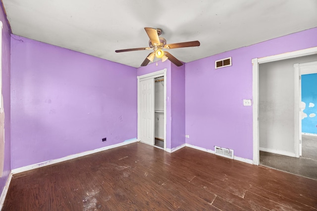 505 E 146th St, Dolton, IL 60419 - unfurnished bedroom with wood finished floors, baseboards, ceiling fan, and a closet