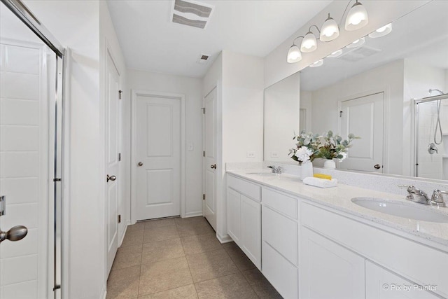 1715 Bayberry Ln, Pingree Grove, IL 60140 - bathroom featuring a stall shower, double vanity, and tile patterned flooring
