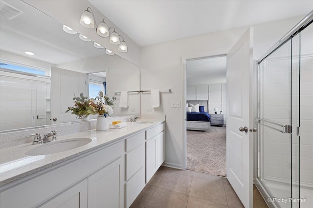 1715 Bayberry Ln, Pingree Grove, IL 60140 - bathroom with double vanity, ensuite bathroom, a shower stall, tile patterned flooring, and baseboards