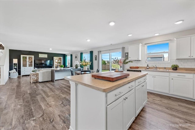 1715 Bayberry Ln, Pingree Grove, IL 60140 - kitchen featuring a sink, light countertops, white cabinetry, backsplash, and recessed lighting