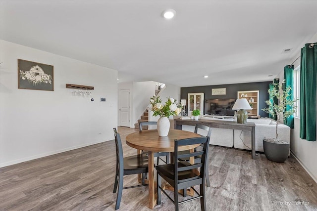 1715 Bayberry Ln, Pingree Grove, IL 60140 - dining space featuring stairs, wood finished floors, and baseboards