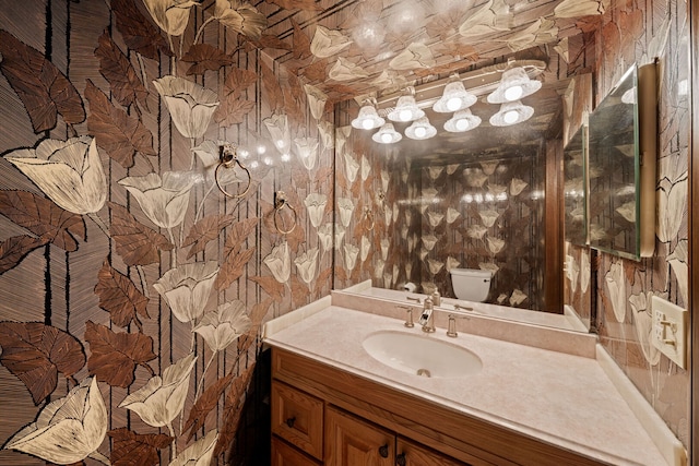 720 Dunhill Dr, Buffalo Grove, IL 60089 - half bathroom featuring vanity and wallpapered walls