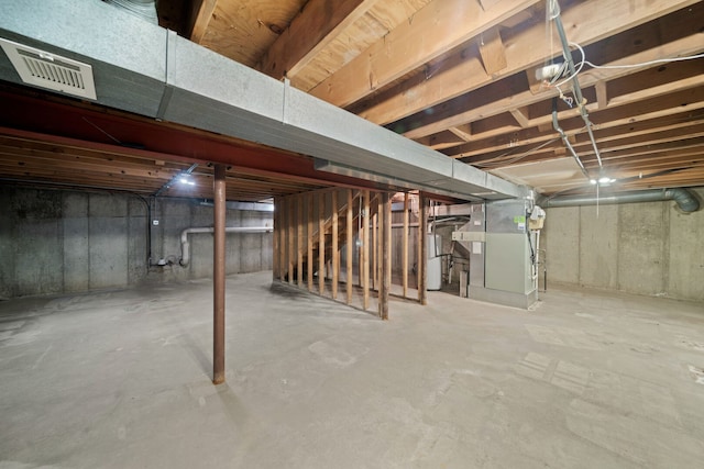 720 Dunhill Dr, Buffalo Grove, IL 60089 - unfinished below grade area with heating unit, stairs, and water heater