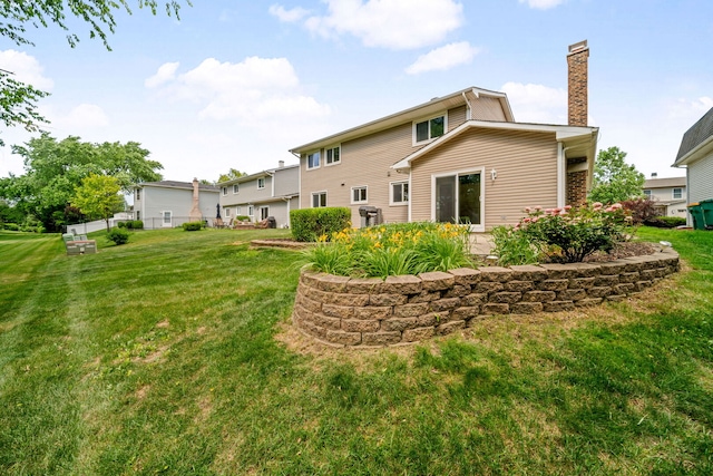 720 Dunhill Dr, Buffalo Grove, IL 60089 - back of property with a chimney and a yard