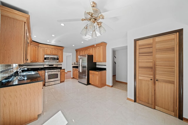 720 Dunhill Dr, Buffalo Grove, IL 60089 - kitchen with stainless steel appliances, dark countertops, recessed lighting, a ceiling fan, and light tile patterned floors