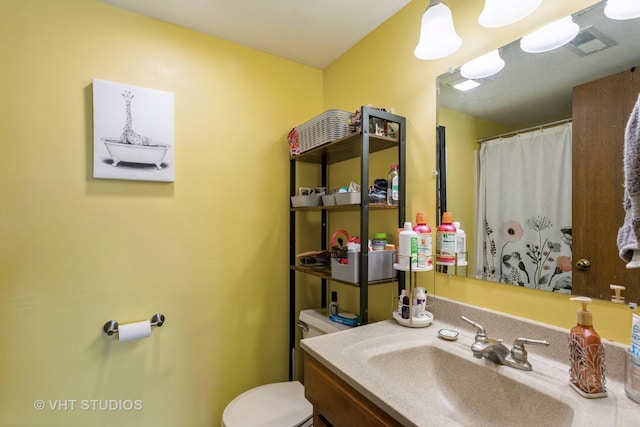 16807 81st Ave Unit 2S, Tinley Park, IL 60477 - bathroom featuring toilet, vanity, and a shower with shower curtain