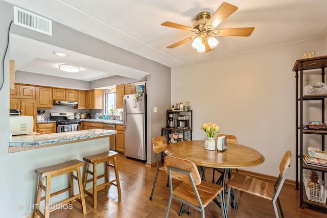 16807 81st Ave Unit 2S, Tinley Park, IL 60477 - dining space featuring wood finished floors, ceiling fan, and baseboards