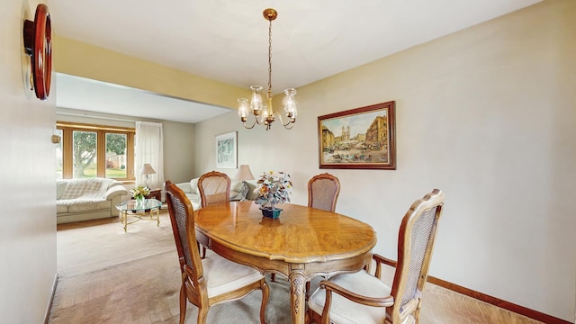 1510 W Goldengate Dr, Addison, IL 60101 - dining area with light carpet and a chandelier