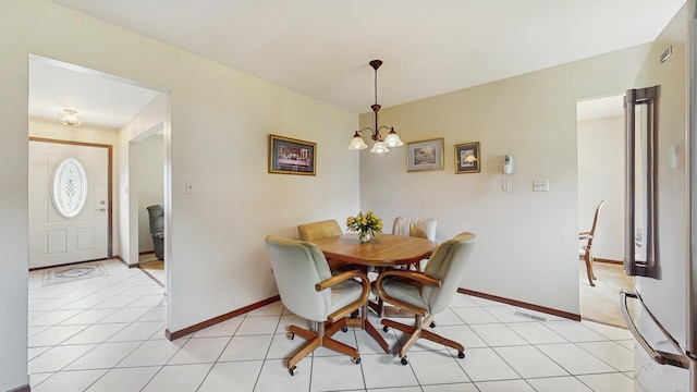 1510 W Goldengate Dr, Addison, IL 60101 - dining room with a chandelier and light tile patterned flooring