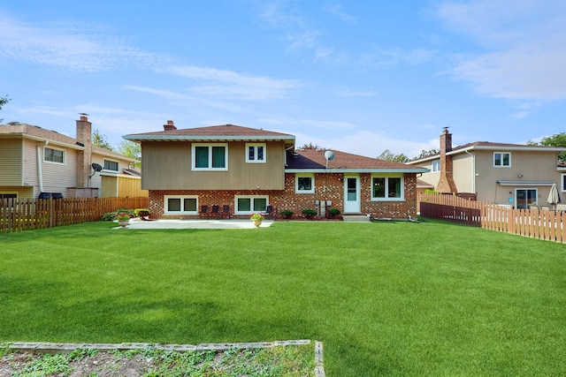 1510 W Goldengate Dr, Addison, IL 60101 - rear view of house featuring a fenced backyard, a patio area, and brick siding