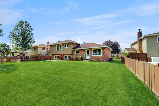 1510 W Goldengate Dr, Addison, IL 60101 - rear view of house with a fenced backyard and brick siding