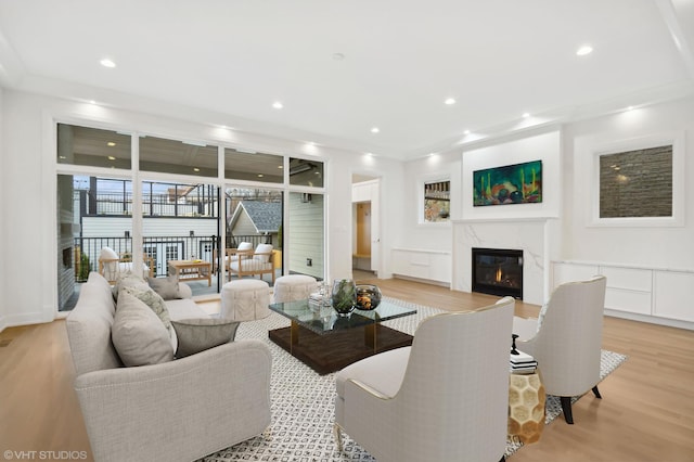 4242 N Winchester Ave, Chicago, IL 60613 - living area with light wood-style flooring, a premium fireplace, and recessed lighting