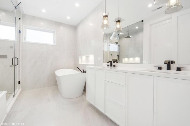 4242 N Winchester Ave, Chicago, IL 60613 - full bath with a stall shower, a soaking tub, double vanity, tile walls, and recessed lighting
