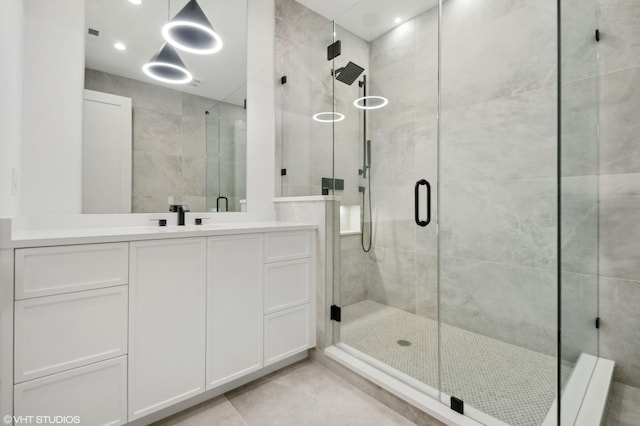 4242 N Winchester Ave, Chicago, IL 60613 - full bath with a stall shower, vanity, and tile patterned flooring