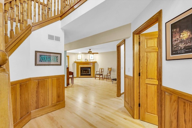 1206 Wilshire Ct, Champaign, IL 61821 - hallway with wainscoting and light wood-style floors