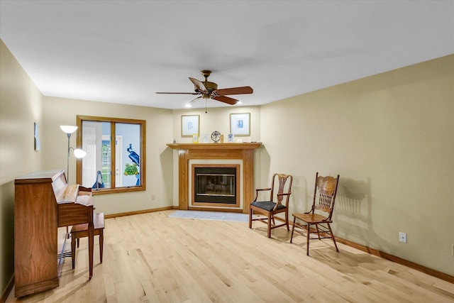 1206 Wilshire Ct, Champaign, IL 61821 - living area with wood finished floors, baseboards, ceiling fan, and a glass covered fireplace