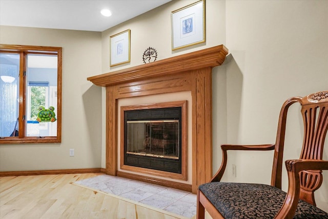 1206 Wilshire Ct, Champaign, IL 61821 - detailed view of wood finished floors, baseboards, a glass covered fireplace, and recessed lighting