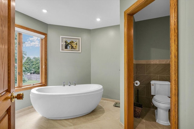 1206 Wilshire Ct, Champaign, IL 61821 - full bathroom featuring a freestanding tub, toilet, plenty of natural light, baseboards, and recessed lighting