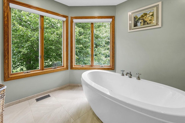 1206 Wilshire Ct, Champaign, IL 61821 - full bath with a freestanding bath, baseboards, and tile patterned floors