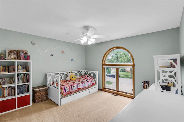1206 Wilshire Ct, Champaign, IL 61821 - carpeted bedroom featuring ceiling fan and access to exterior