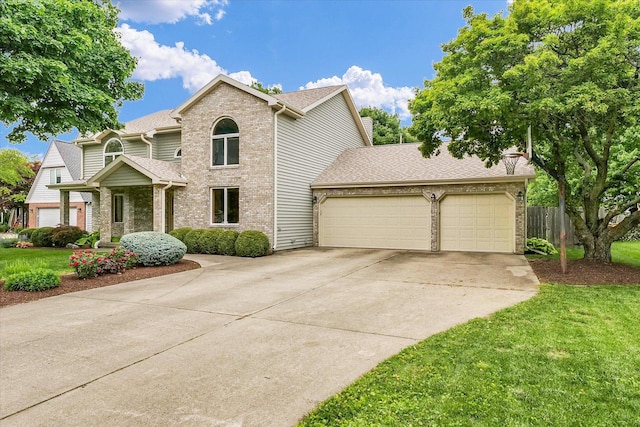 1206 Wilshire Ct, Champaign, IL 61821 - traditional home featuring brick siding, a garage, driveway, and a shingled roof