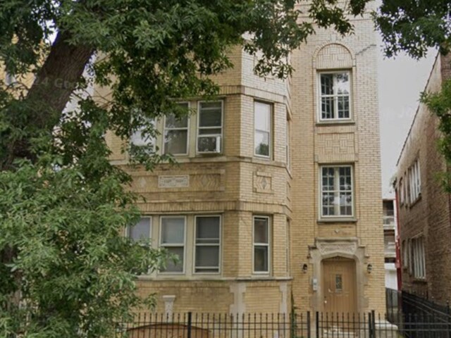 7921 S Hermitage Ave, Chicago, IL 60620 - view of building exterior with a fenced front yard