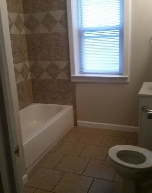 7921 S Hermitage Ave, Chicago, IL 60620 - full bath featuring tile patterned floors, toilet, vanity, and baseboards