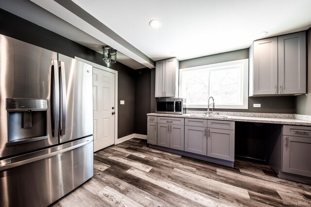 820 E 74th St, Chicago, IL 60619 - kitchen featuring stainless steel appliances, a sink, gray cabinets, dark wood-type flooring, and recessed lighting