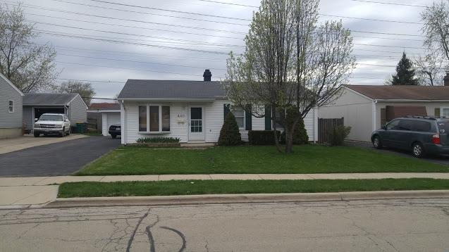 446 Montrose Dr, Romeoville, IL 60446 - ranch-style house with a front lawn and a garage