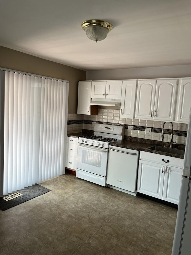 446 Montrose Dr, Romeoville, IL 60446 - kitchen with white appliances, dark countertops, white cabinets, and under cabinet range hood
