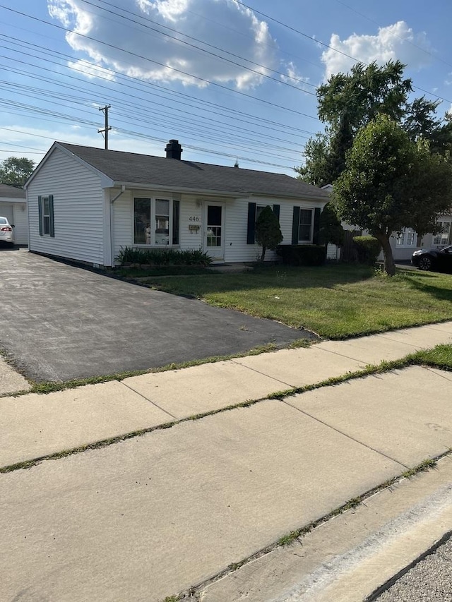 446 Montrose Dr, Romeoville, IL 60446 - ranch-style home featuring a front lawn, driveway, and a chimney