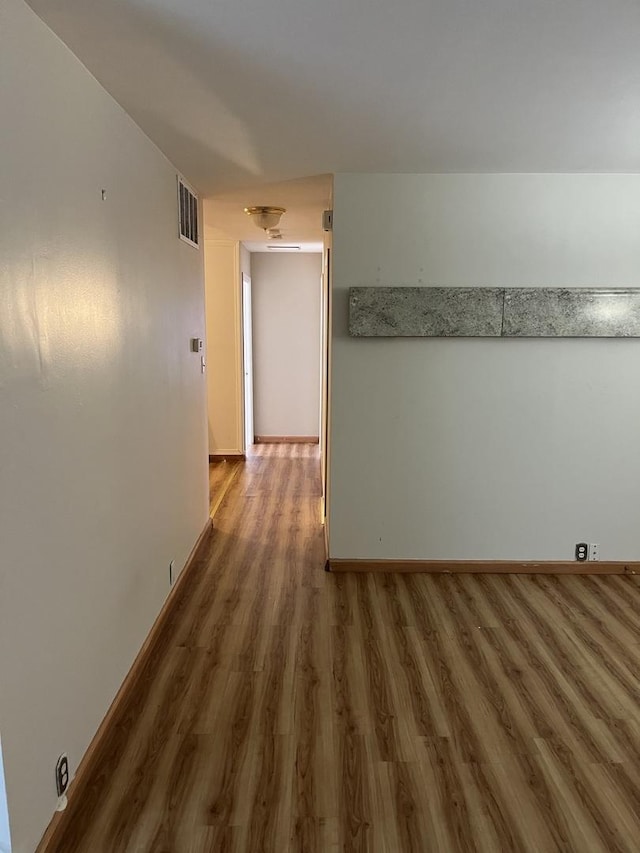446 Montrose Dr, Romeoville, IL 60446 - empty room featuring wood finished floors and baseboards