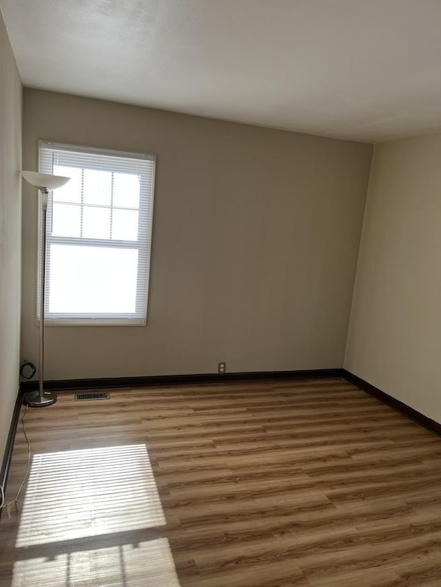 446 Montrose Dr, Romeoville, IL 60446 - unfurnished room with wood finished floors and baseboards