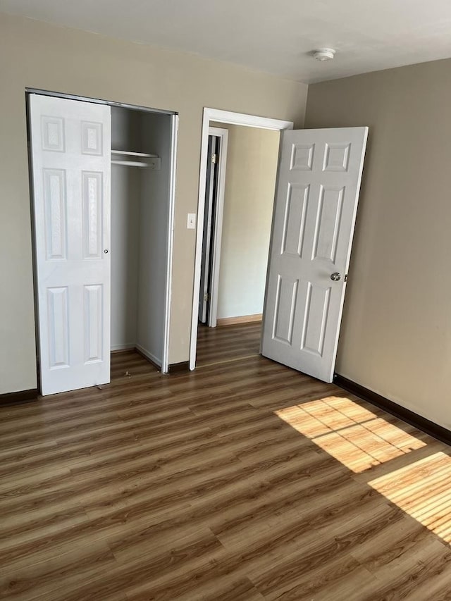 446 Montrose Dr, Romeoville, IL 60446 - unfurnished bedroom featuring wood finished floors and a closet