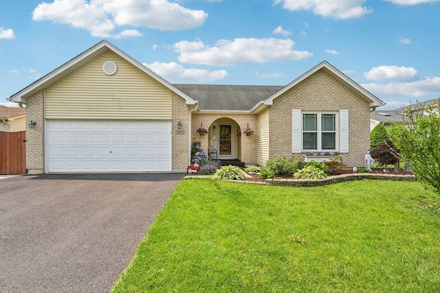 1043 San Mateo Dr, Romeoville, IL 60446 - view of front of home featuring brick siding, asphalt driveway, an attached garage, and a shingled roof