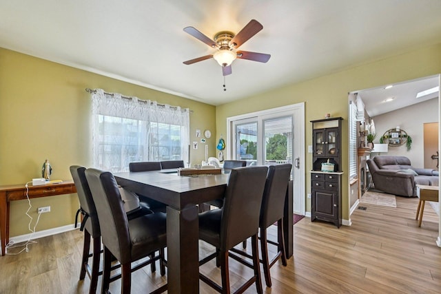 1043 San Mateo Dr, Romeoville, IL 60446 - dining room with ceiling fan, light wood-style flooring, and baseboards